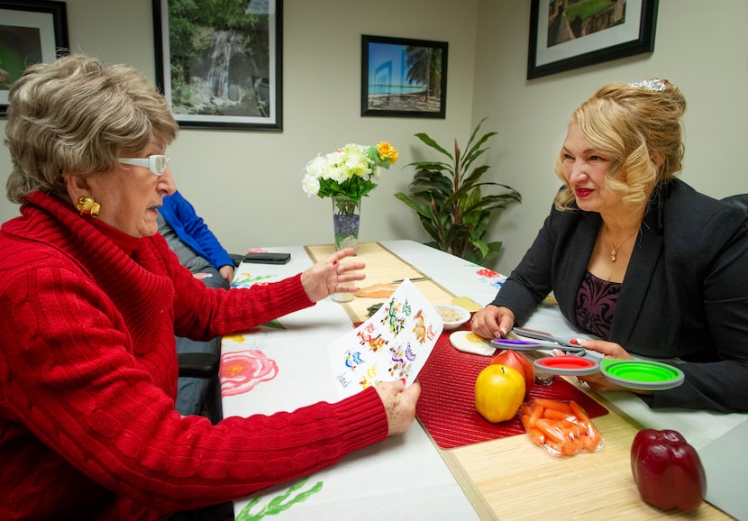 Joaquina Celorio, left, discusses her diet with dietitian/nutritionist Araceli Vazquez...