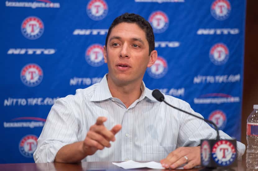 Texas Rangers general manager Jon Daniels introduces newly signed outfielder Josh Hamilton...