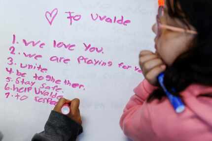 Luis Martinez (left), 8, and Catherine Flutsch, 8, students at F.P. Caillet Elementary...