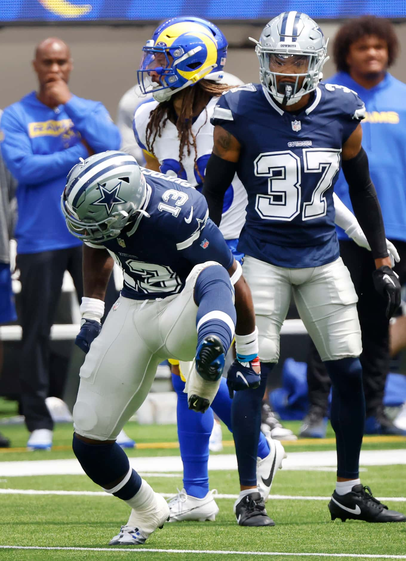 Dallas Cowboys linebacker DeMarvion Overshown (13) celebrates his tackle for loss against...