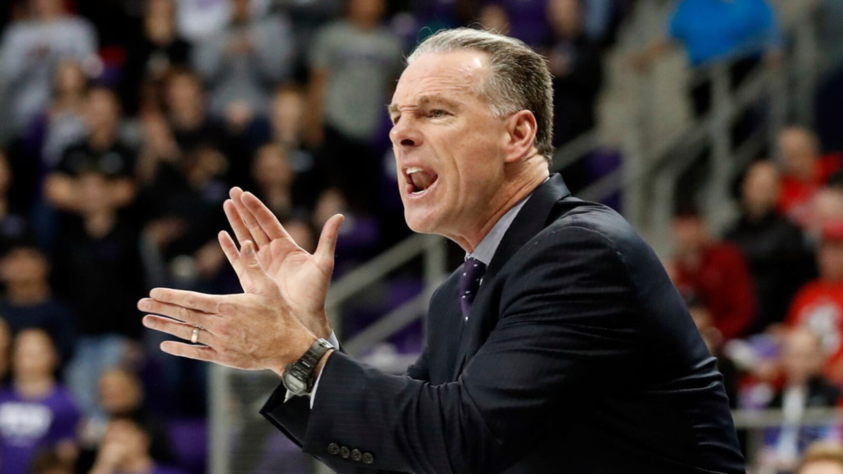TCU head coach Jamie Dixon instructs his team in the second half of an NCAA college...