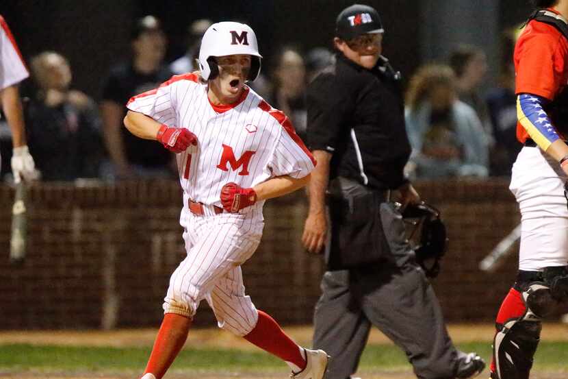 Flower Mound Marcus' Nick Mazzola scores a run in the first inning during Marcus' 6-4...