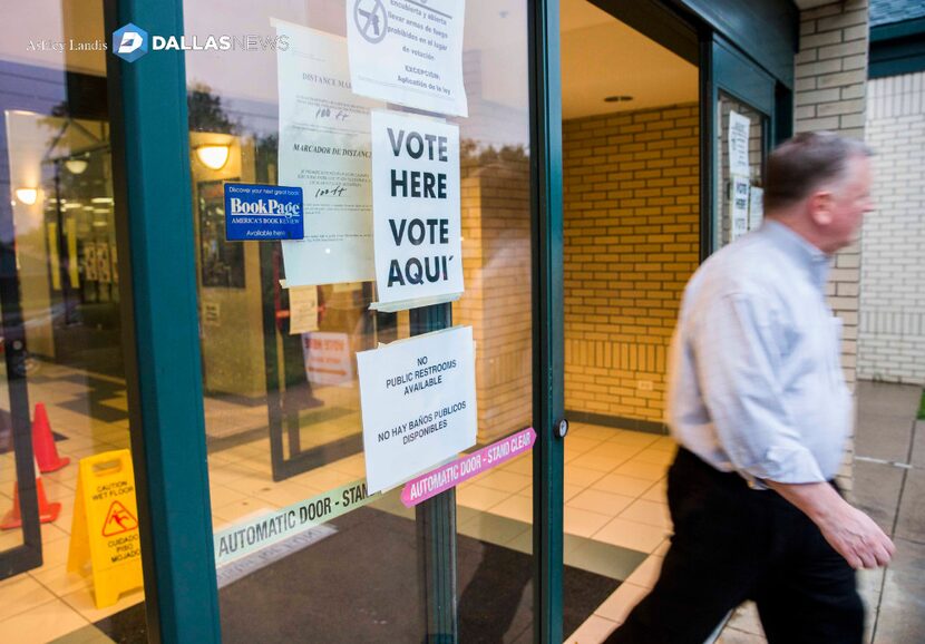 A man exits a polling place on Tuesday, November 8, 2016 at the North East Branch of the...