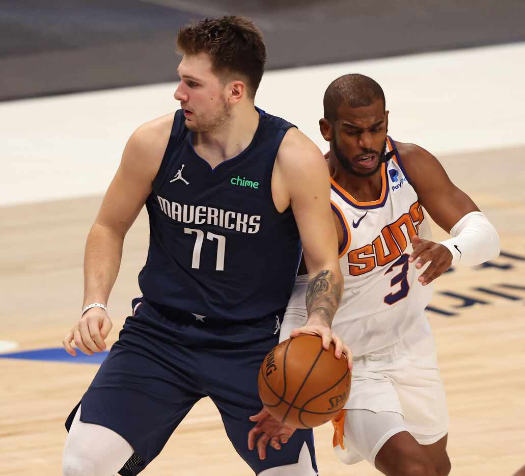 Phoenix Suns guard Chris Paul (3) steals the ball from Dallas Mavericks guard Luka Doncic...