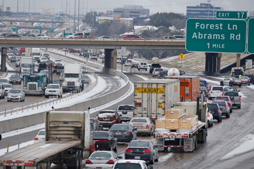  Traffic stacks up on LBJ 635 as police work an accident in northeast Dallas on Thursday....