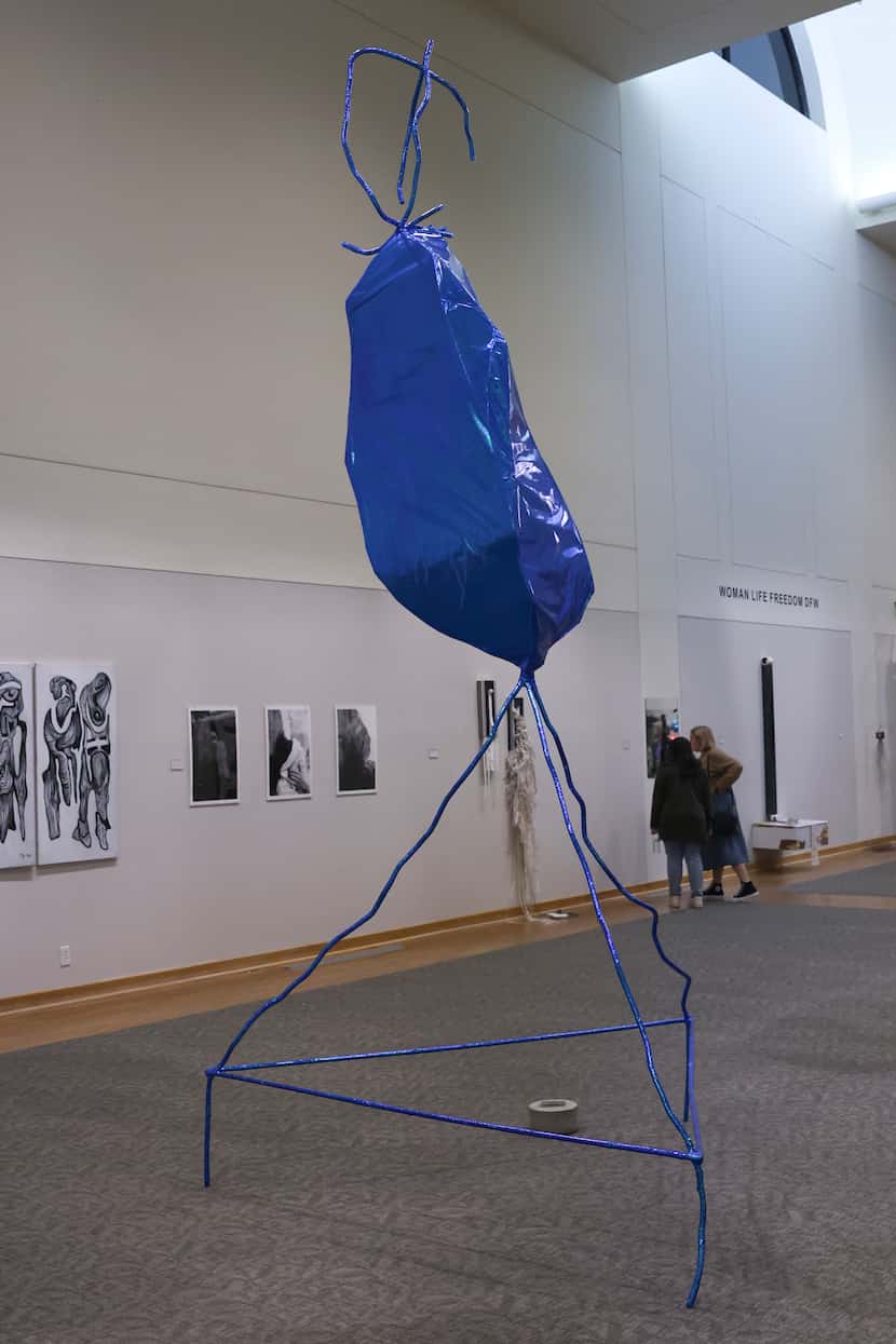 Mari Hidalgo King’s “Y.O.M.P,” a shiny blue sculpture, is meant to capture “the intrinsic...