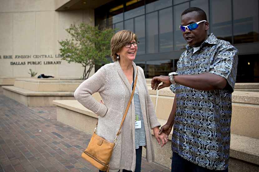 Sarah Bartfield (left) smiles as she waits with James Williams before he goes in to vote on...