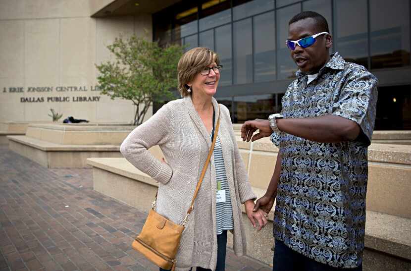 Sarah Bartfield (left) smiles as she waits with James Williams before he goes in to vote on...