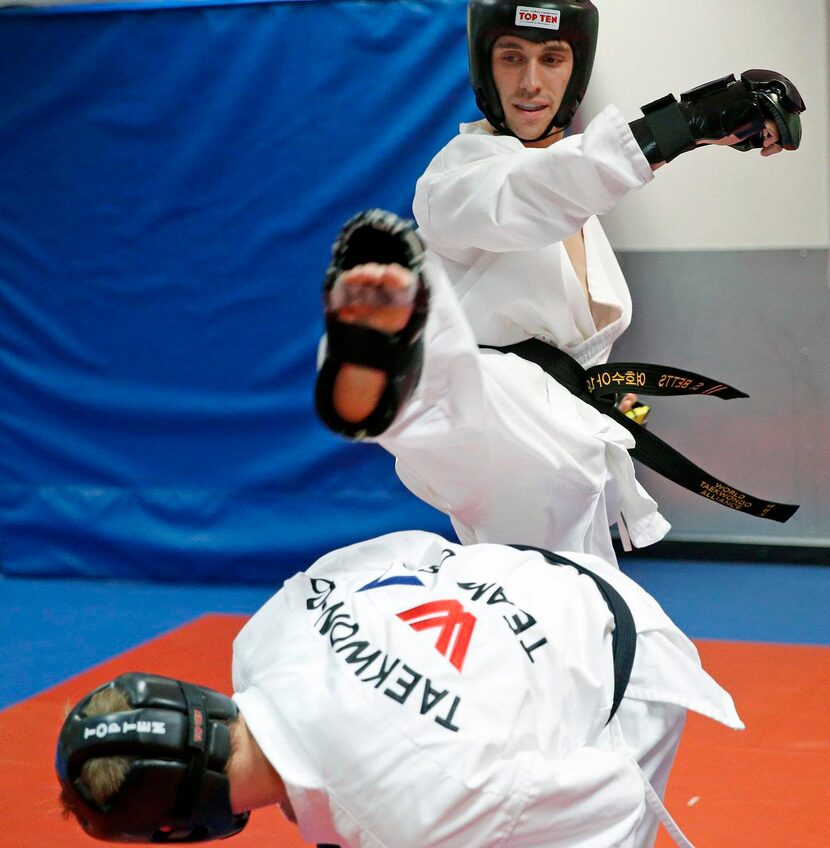 
Samuel Betts (top) spars with Colton McNeely during a practice. July 24-26, students from...