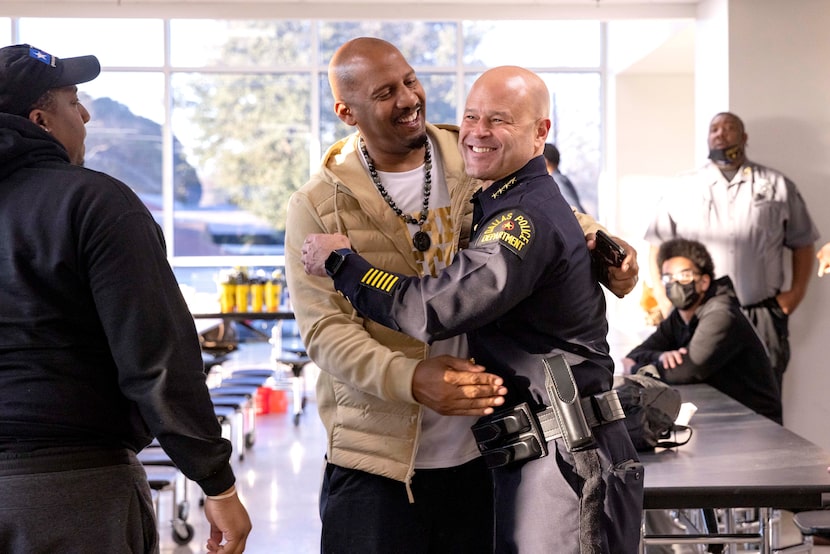 South Oak Cliff High School principal Willie Johnson (center left) greeted Dallas police...