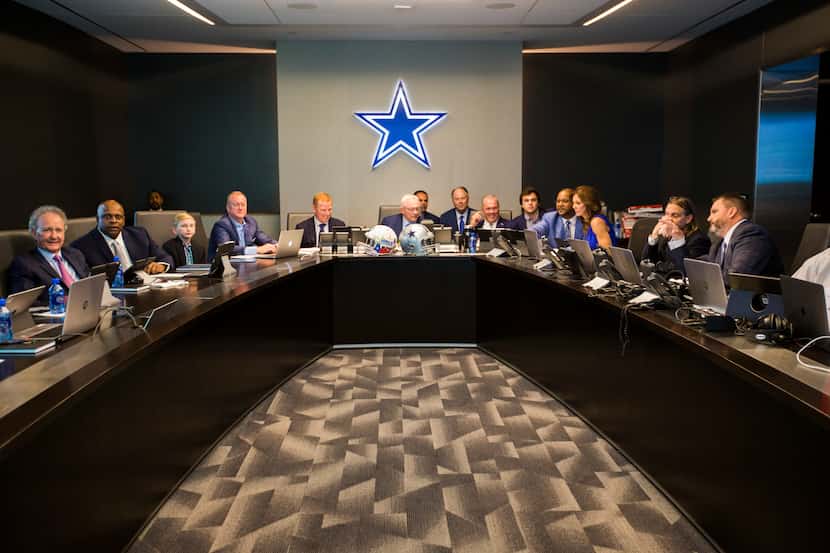 Dallas Cowboys Owner Jerry Jones, center, Head Coach Jason Garrett, center left, CEO and...