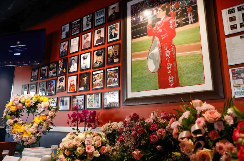 Flowers and funeral wreaths stand inside Casita Tex-Mex Bar and Grill where a celebration of...