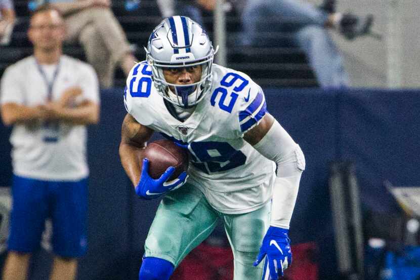 Dallas Cowboys defensive back C.J. Goodwin (29) runs the ball after an interception against...