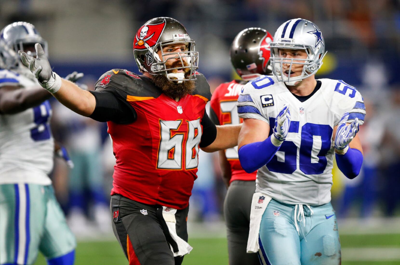 IMAGE DISTRIBUTED FOR JCPENNEY - Dallas Cowboys linebacker Sean Lee, left,  shops alongside Ajion Lair, 18, from the Boys & Girls Club of Greater Dallas  as he selects gifts for his family