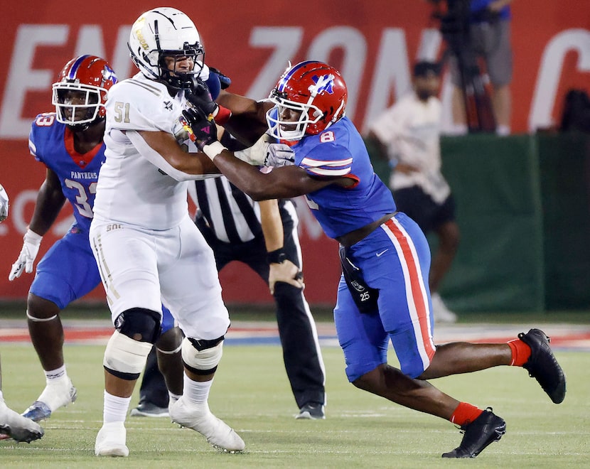 Duncanville defensive end Colin Simmons (8) tries to get around South Oak Cliff’s Jaden...