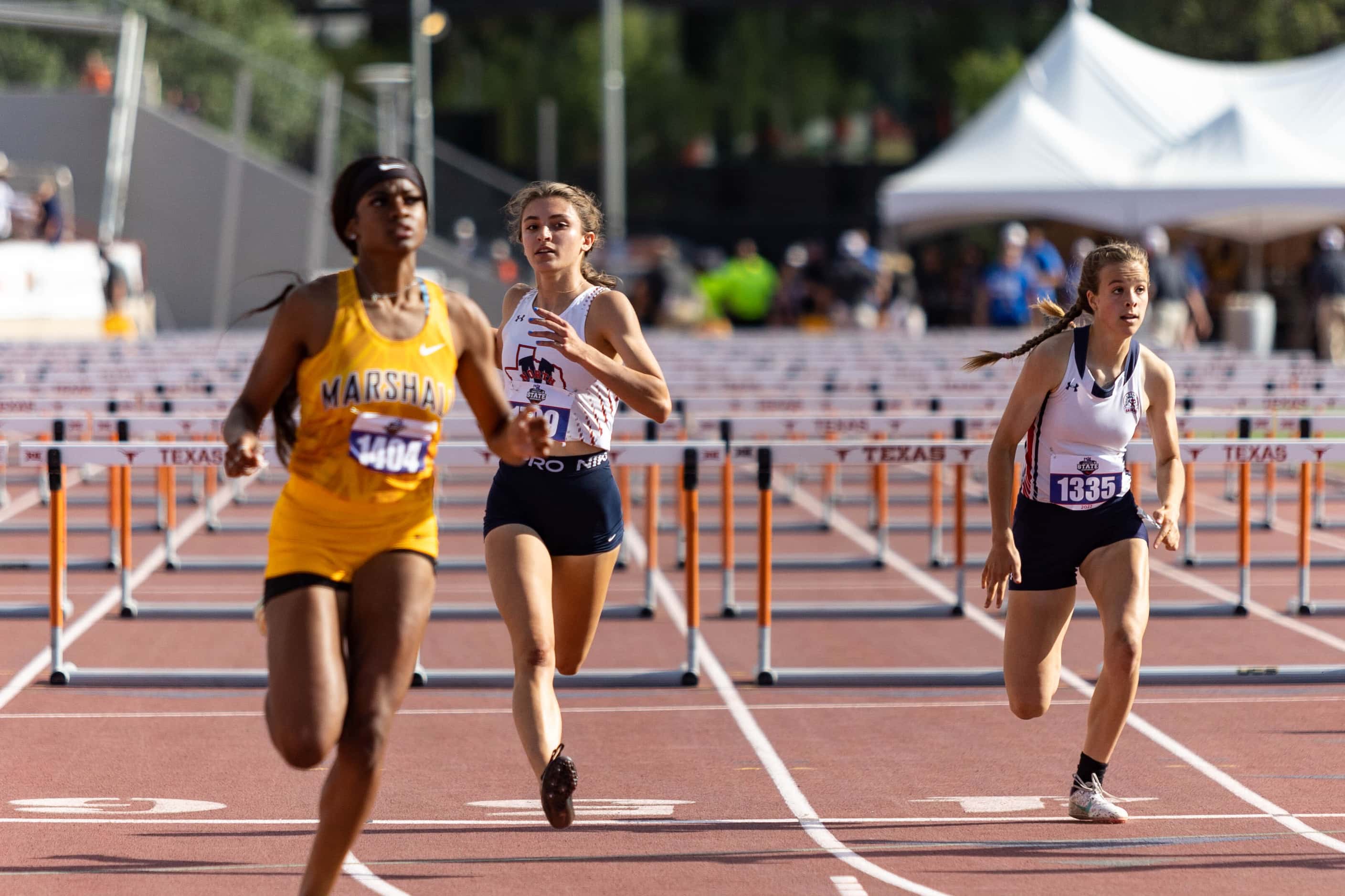 Alexandra Harber of McKinney North crosses the finish line in third during the girls’ 100m...