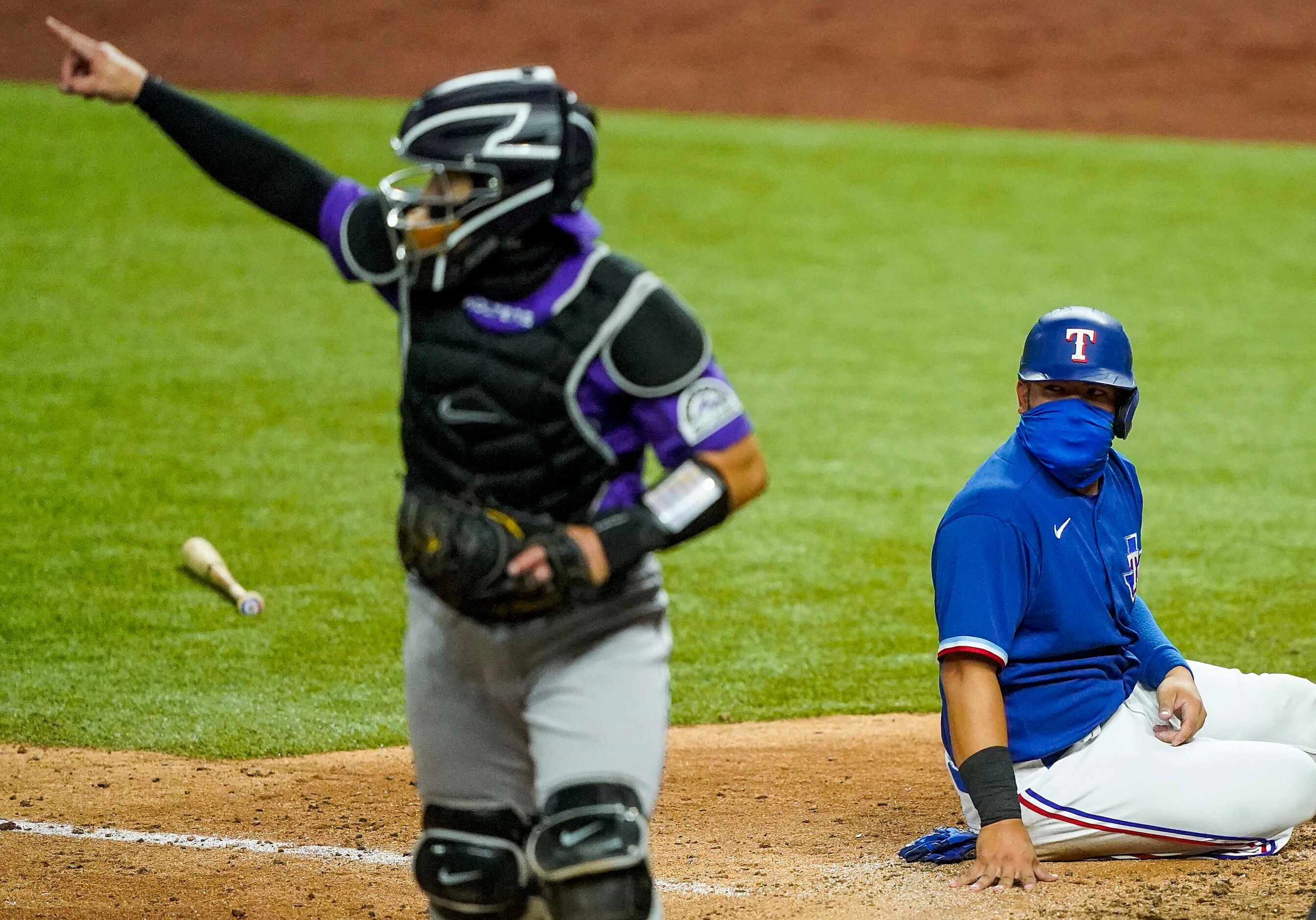 Texas Rangers catcher Jose Trevino reacts after being thrown out at home trying to score on...