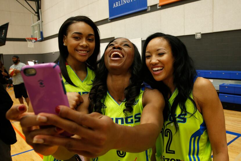 Allisha Gray, (from left) Evelyn Akhator and Saniya Chong pose for a selfie during Dallas...