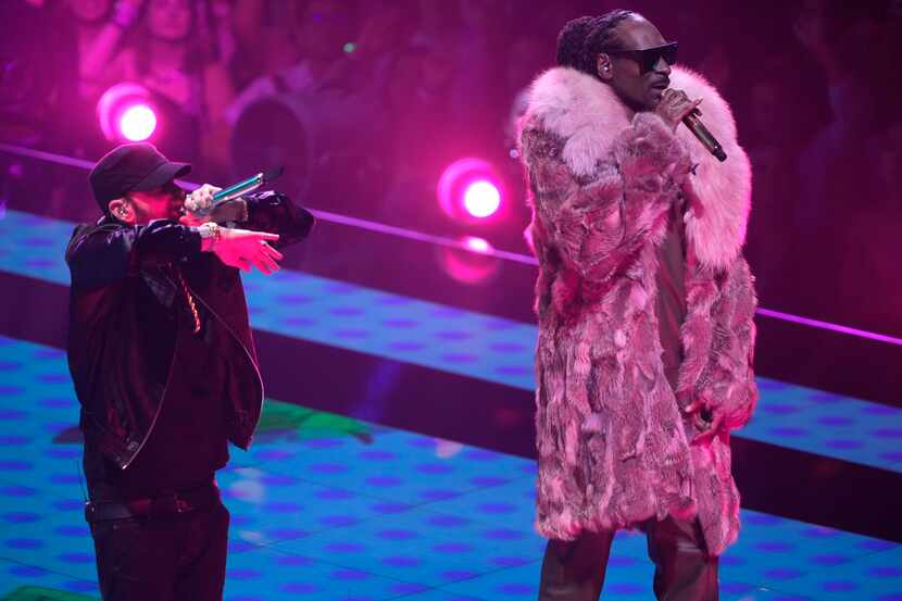 Eminem, left, and Snoop Dogg perform "From the D 2 the LBC"at the MTV Video Music Awards at...