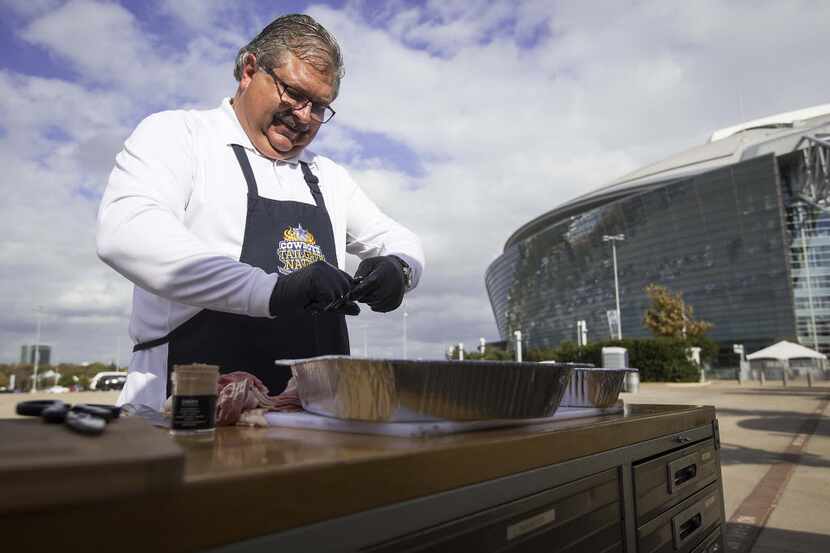 Dallas Cowboys Official Grill Master Randy Lann does prep work for feeding Thanksgiving Day...