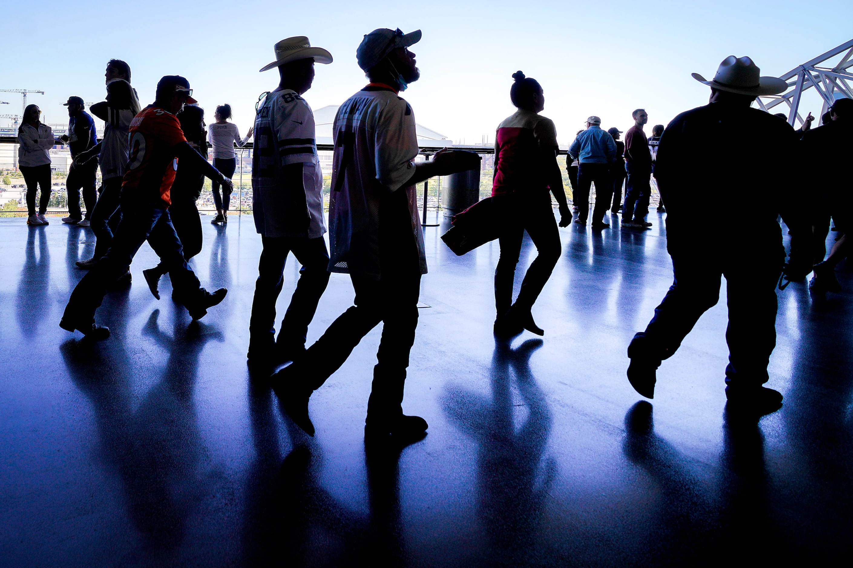 Fans walk on the upper concourse before an NFL football game between the Dallas Cowboys and...