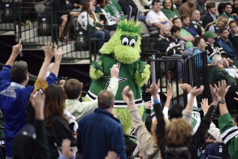 Dallas Stars mascot Victor E. Green gets the fans excited during the third period of their...