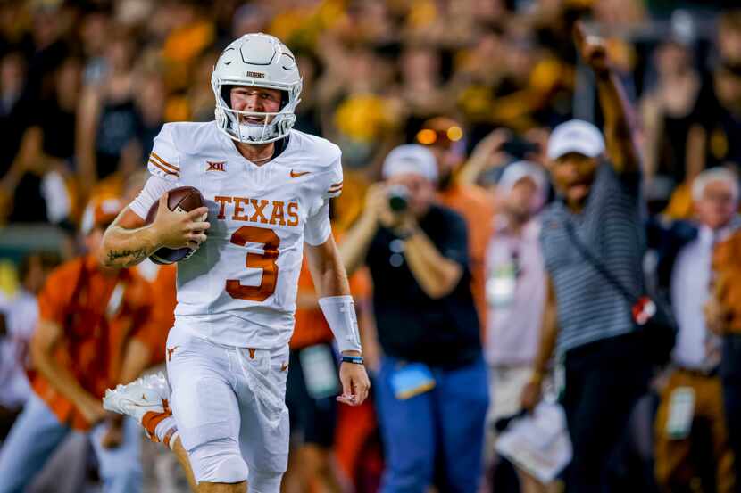 Texas quarterback Quinn Ewers (3) runs for a touchdown against Baylor during the first half...