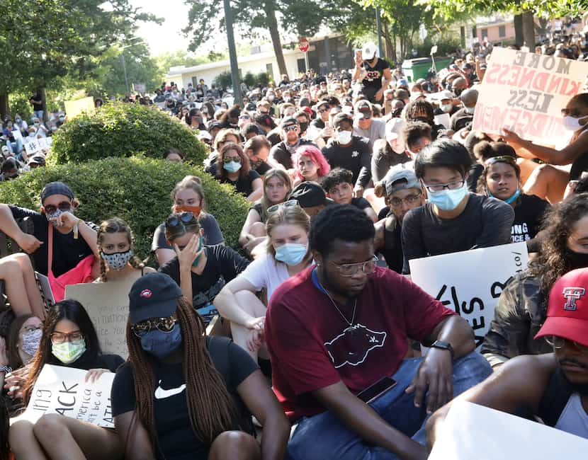 Protesters kneel at the historic town square in McKinney on June 5, 2020.