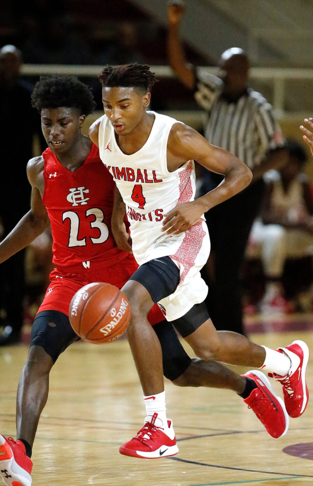 Kimball High School guard Arterio Morris (4) is fouled as he tries to dribble past Cedar...