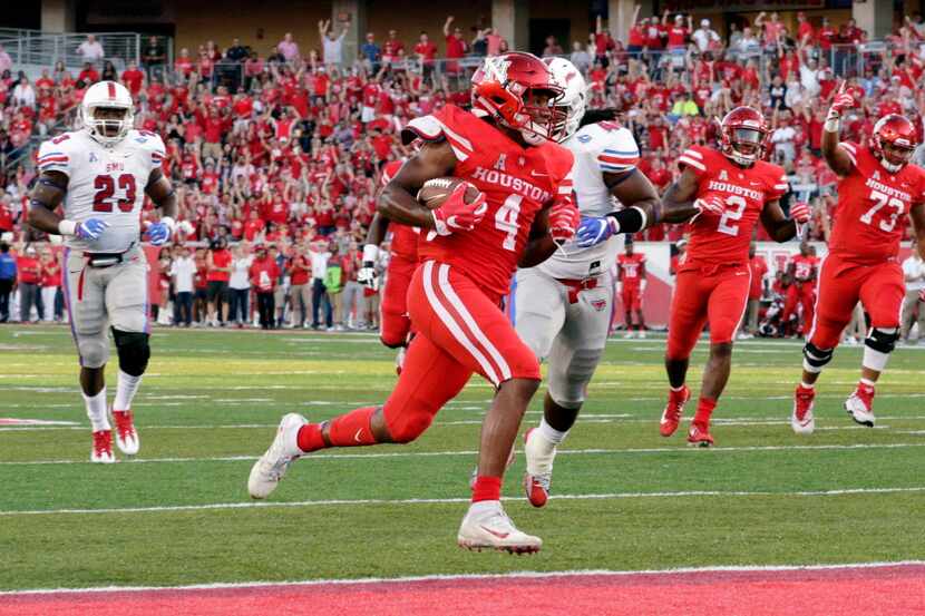 Houston wide receiver D'Eriq King (4) scores against SMU in the first half of an NCAA...