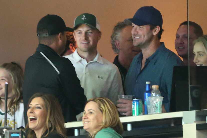 Jordan Spieth and Tony Romo take in the game from a suite during the Dallas Stars vs. the...