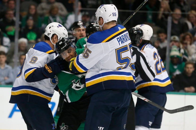 Dallas Stars center Gemel Smith (46) fights with St. Louis Blues right wing Scottie Upshall...