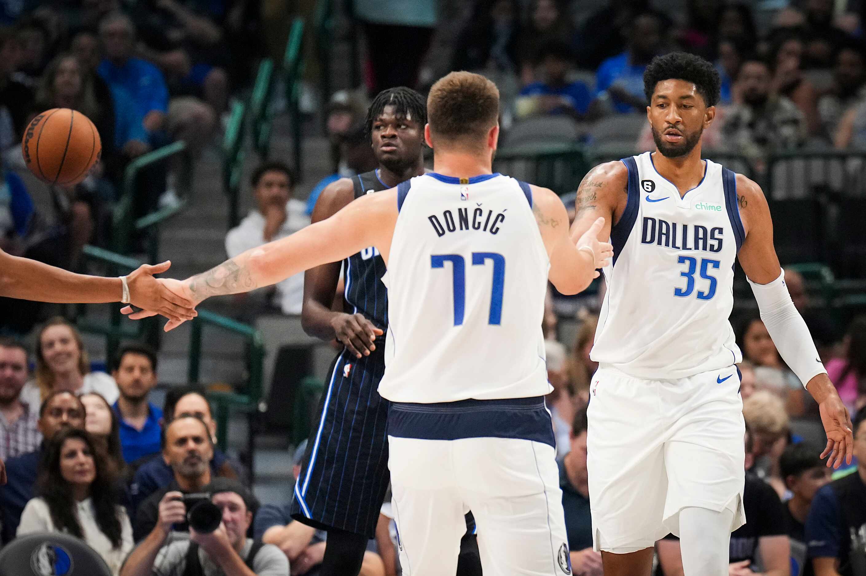 Dallas Mavericks center Christian Wood (35) celebrates with guard Luka Doncic (77) during...