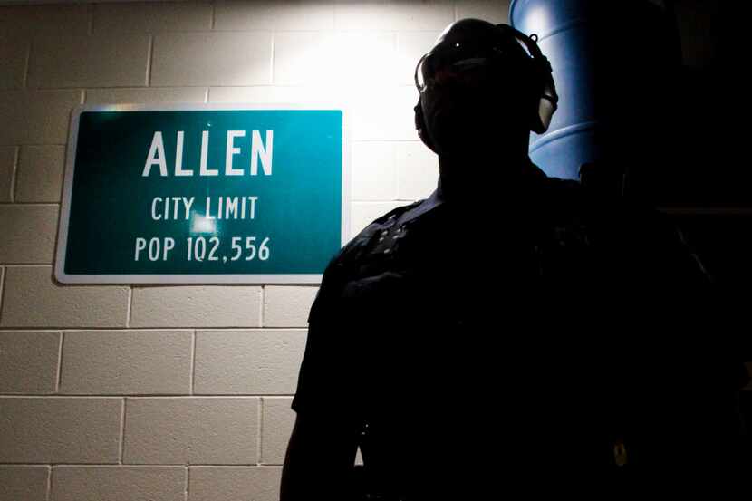 Officer Chris Johnson, a School Resource Officer with the Allen Police Department watches as...
