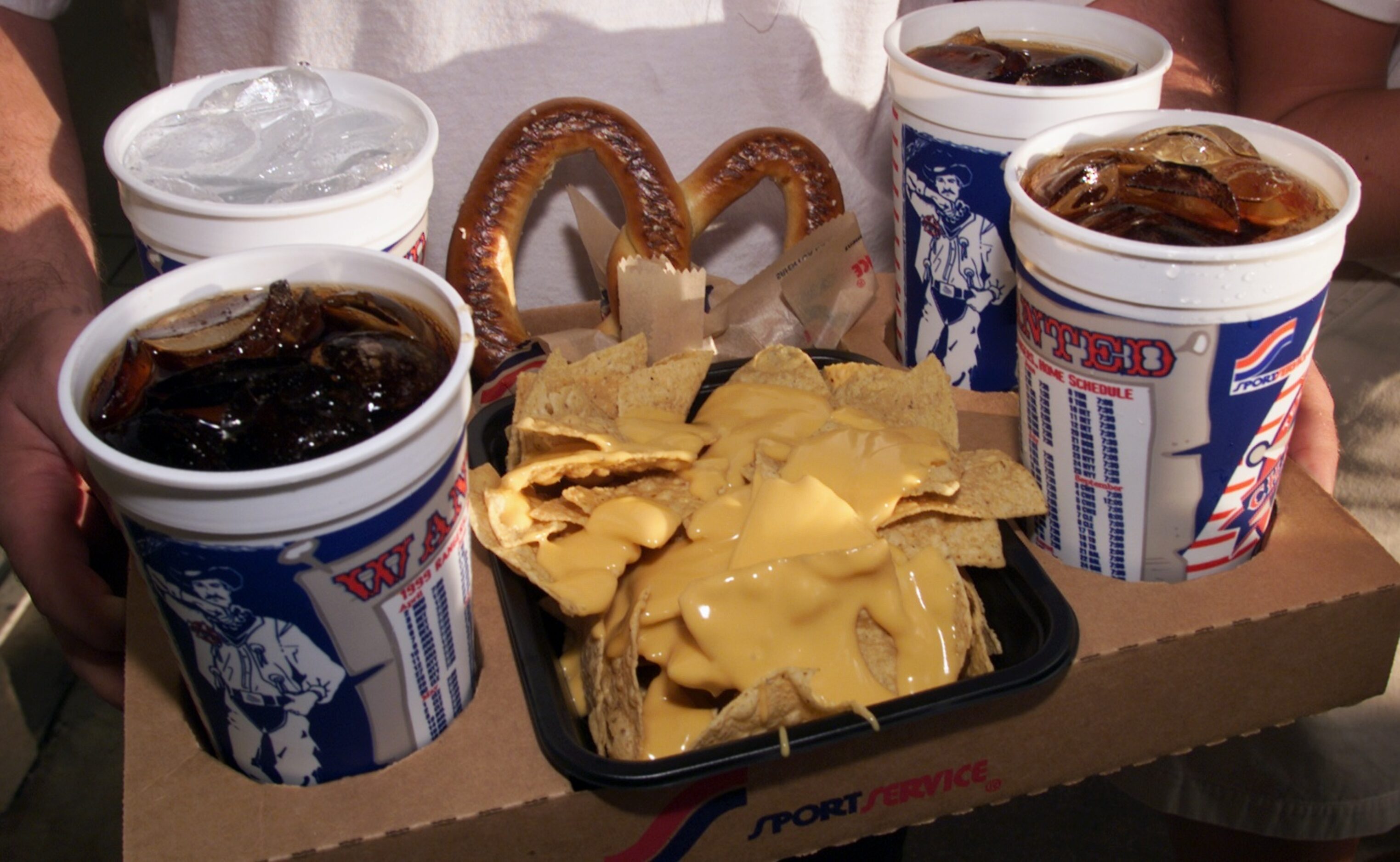 Pretzels, nachos and soft drinks - as in this 1999 photo - are still ballpark favorites today.