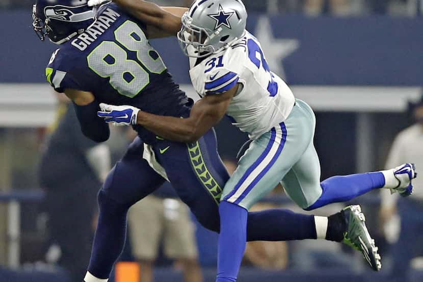 Dallas Cowboys cornerback Byron Jones (31) breaks up a pass meant for Seattle Seahawks tight...