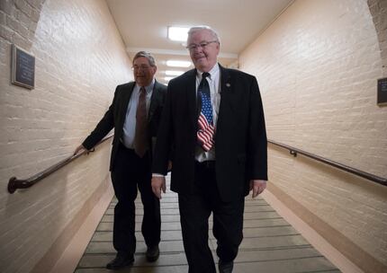Rep. Michael Burgess (left), R-Texas, and Rep. Joe Barton, R-Texas, walked to a meeting with...