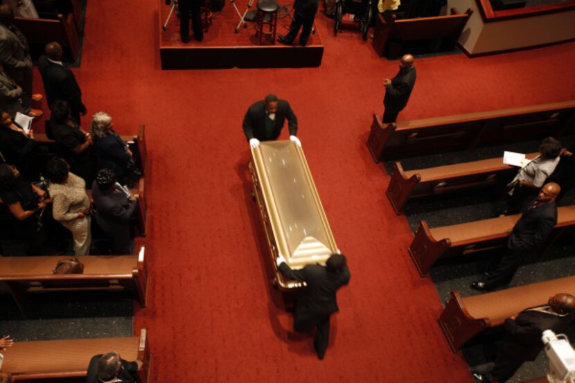 Al Lipscomb's casket was carried out of Friendship-West Baptist Church after the ceremony.