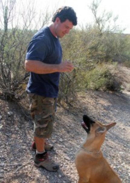  This Jan. 30, 2016, photo shows carnivore biologist Chris Bugbee giving a scent of a jaguar...