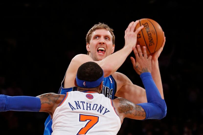 Dallas Mavericks' Dirk Nowitzki works to get open before shooting the game-winning basket...