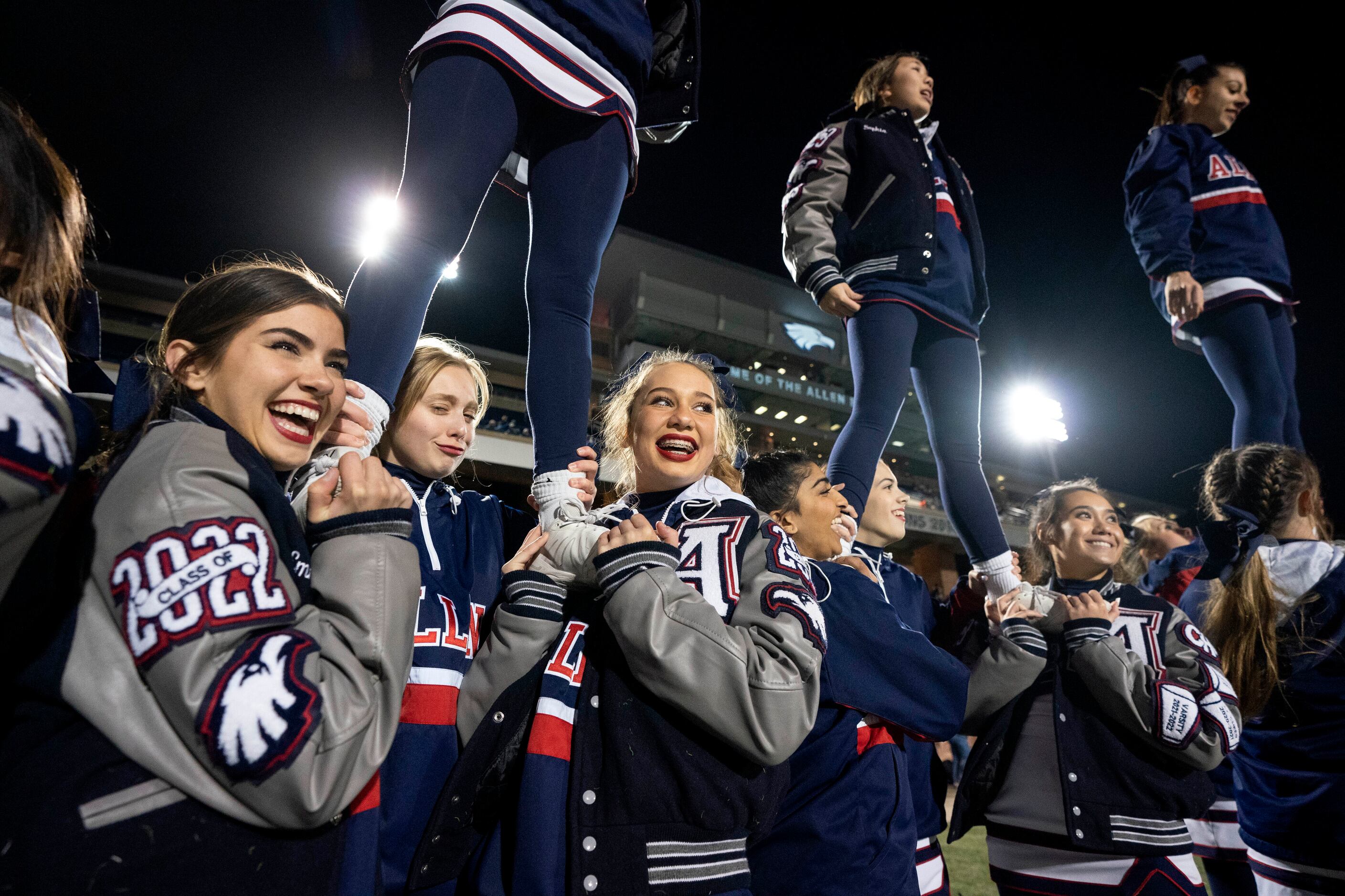 Allen cheerleaders cheer during a kickoff in the second half of a bi-district round high...