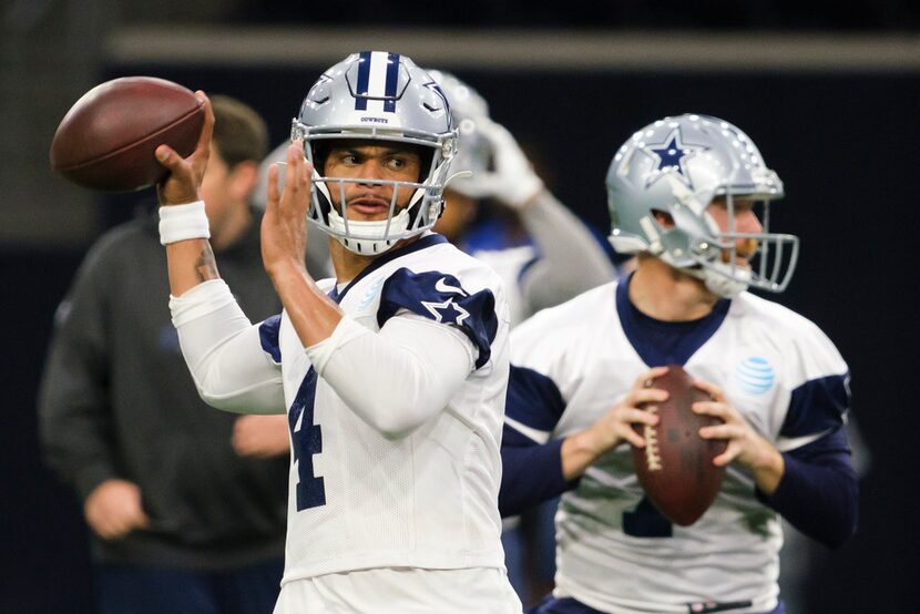 Dallas Cowboys quarterback Dak Prescott (4) and quarterback Cooper Rush (7) throw passes...