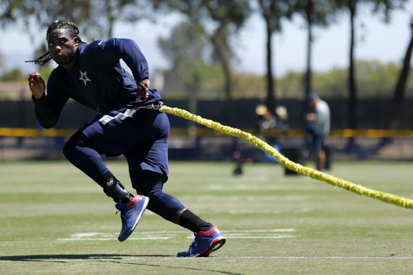 Dallas Cowboys rookie outside linebacker Jaylon Smith works on a resistance cord as he...