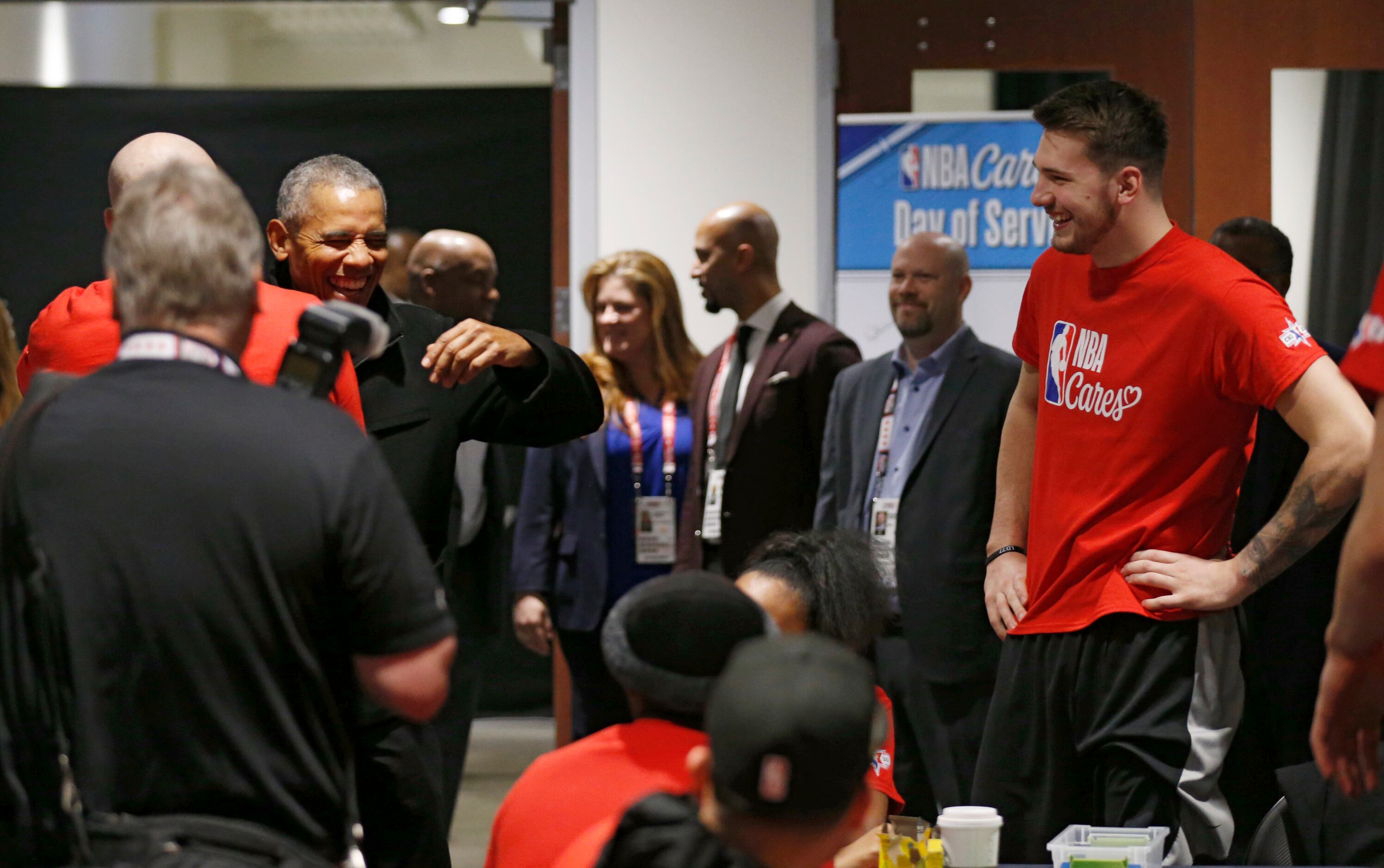 Former President Barack Obama jokes with Los Angeles Lakers assistant coach Jason Kidd as...