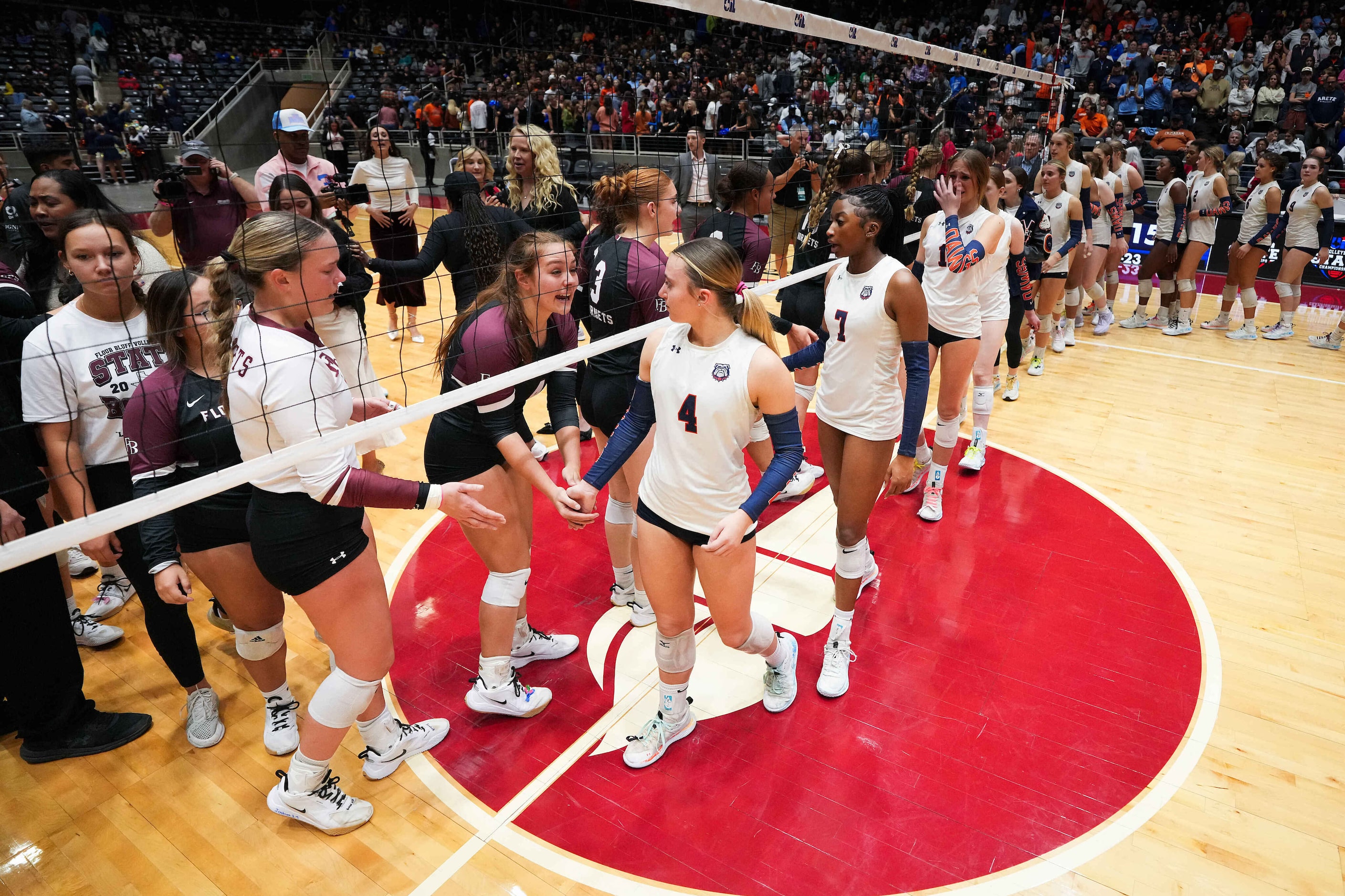 McKinney North's Jordan Kowallis (4) leads her teammates as they shake hands with the Corpus...