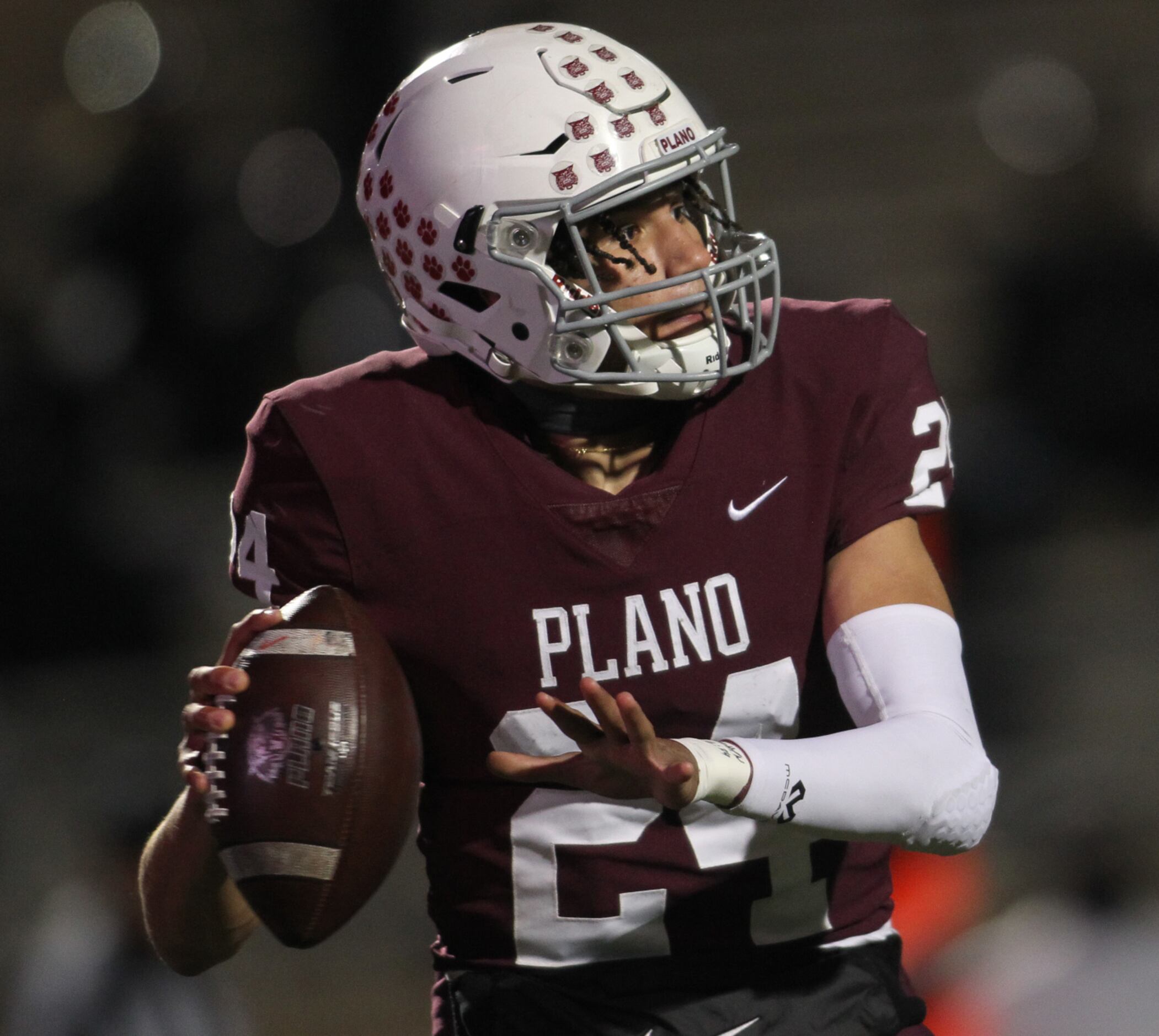 Plano quarterback Oliver Towns (24) prepares to launch a pass downfield during the second...
