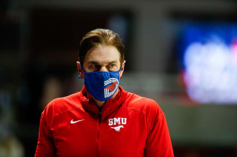 SMU head basketball coach Tim Jankovich watches from the sideline during the first half of a...