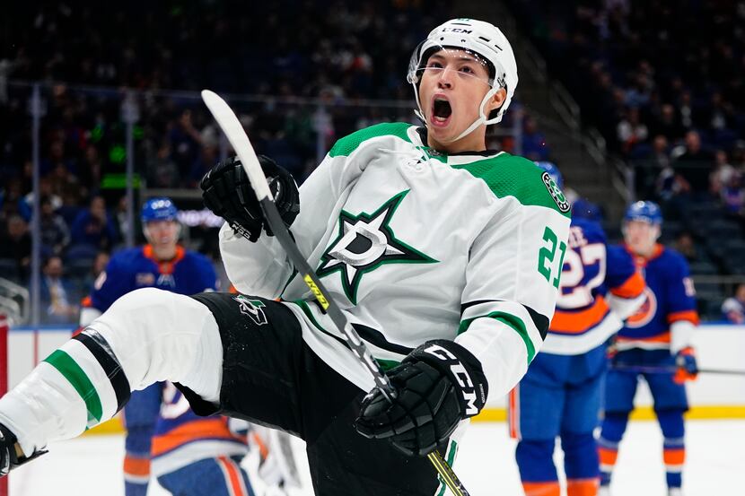 Dallas Stars' Jason Robertson celebrates after scoring a goal during the first period of an...
