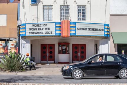 Traffic zooms past the closed Texas Theatre on Jefferson on West Jefferson Boulevard.