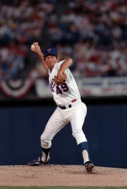 04/04/88-- Rangers' pitcher Charlie Hough gets ready to throw one home during the Rangers'...